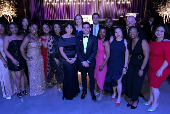 A group photo of Pride EBN members and business leaders dressed in cocktail attire at the Center on Halsted’s spring gala